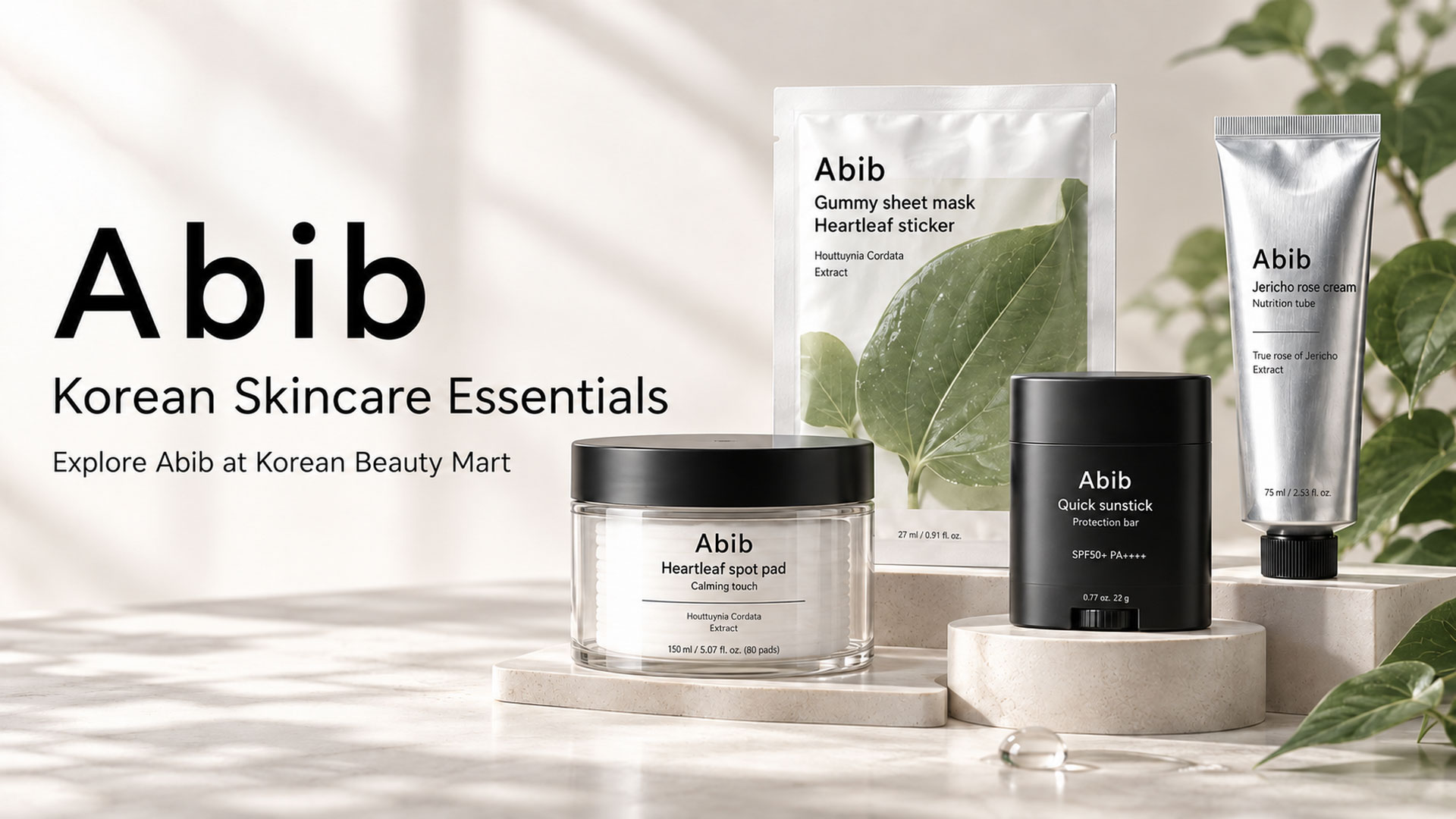 Abib Heartleaf toner pads, sheet mask, black sunstick and silver cream tube on ivory display stands.