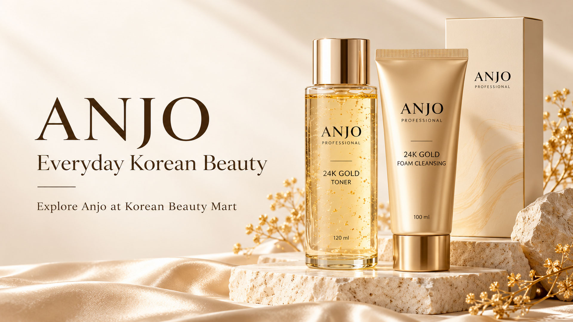 ANJO Professional 24K Gold Toner and Foam Cleansing in champagne-gold packaging on an ivory stone display.