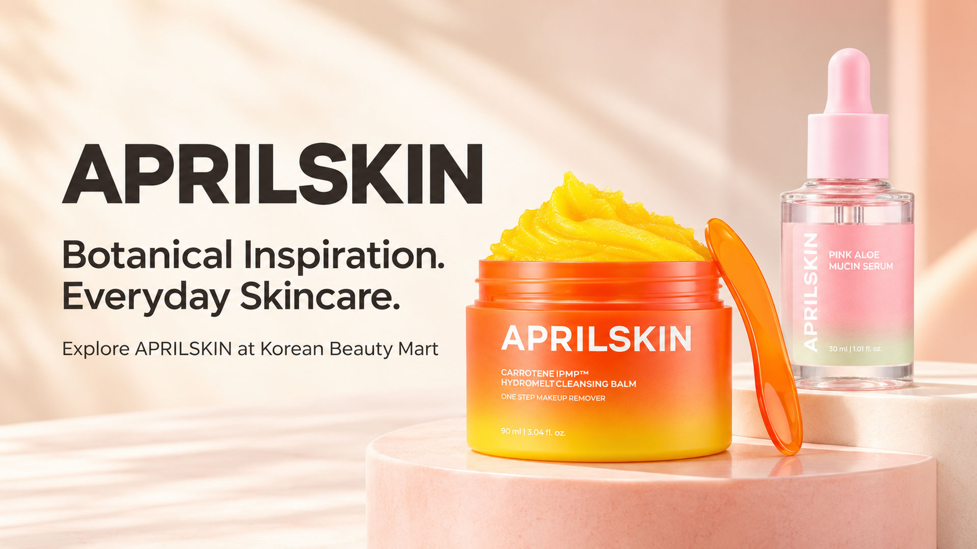 APRILSKIN Carrotene cleansing balm and Pink Aloe Mucin Serum illustrations on an ivory and blush display beside the words Botanical Inspiration. Everyday Skincare.
