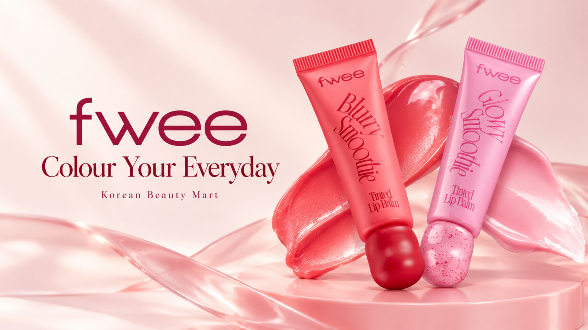 FWEE Blurry and Glowy Smoothie tinted lip balm tubes on a blush background for Korean Beauty Mart.