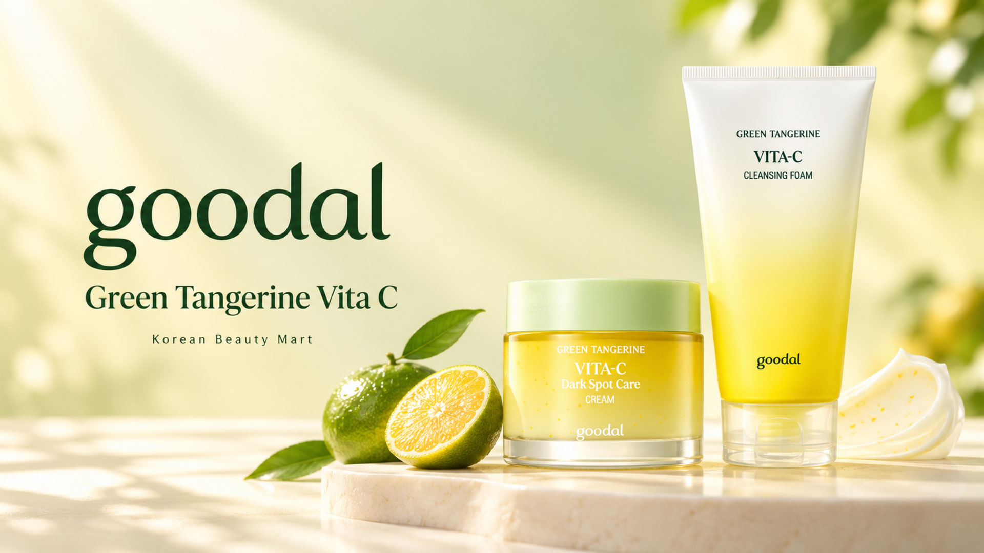 Goodal Green Tangerine Vita C cleansing foam tube and cream jar with green tangerines on a pale yellow background.