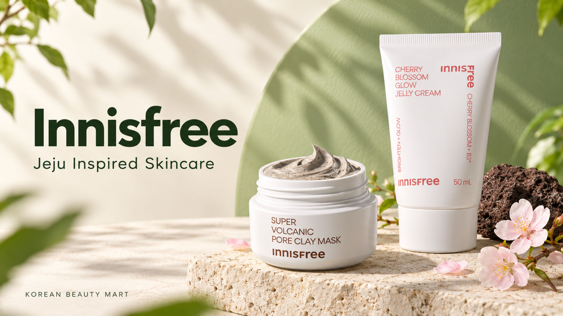 Innisfree Cherry Blossom Glow Jelly Cream tube and Super Volcanic Pore Clay Mask jar on an ivory and green backdrop.