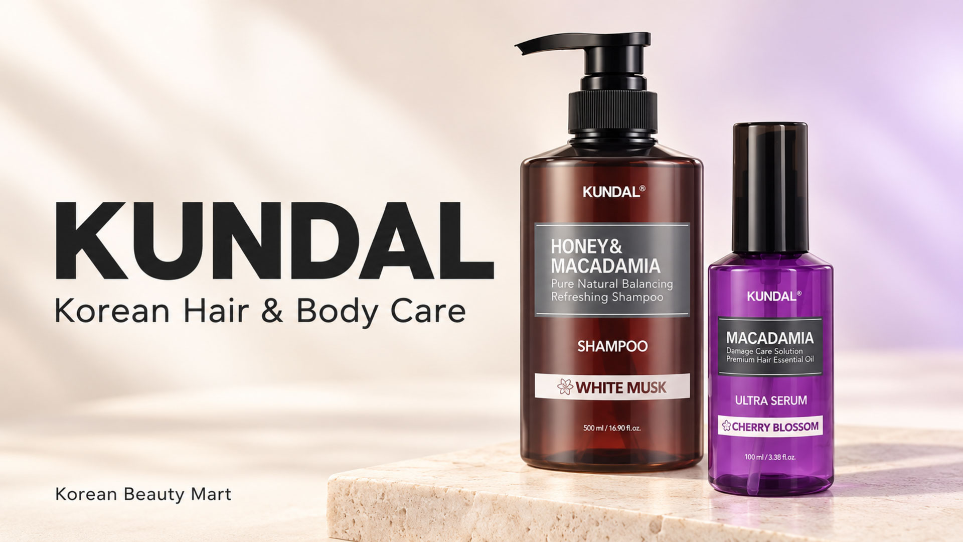 KUNDAL White Musk shampoo and purple Cherry Blossom Ultra Serum bottles on an ivory and lavender studio background.